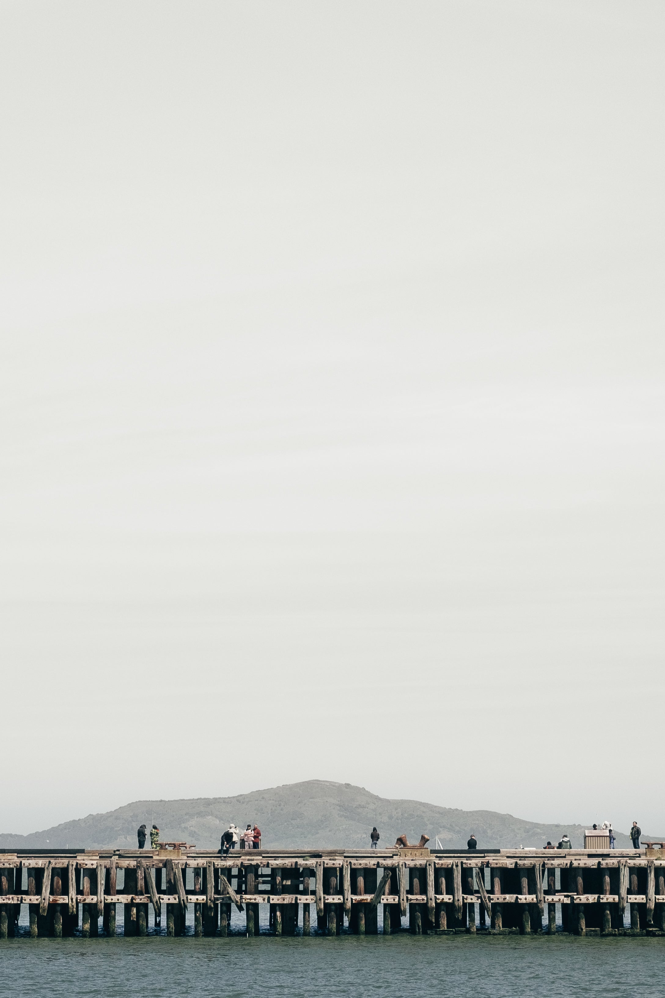 wooden-pier-under-grey-sky.jpg